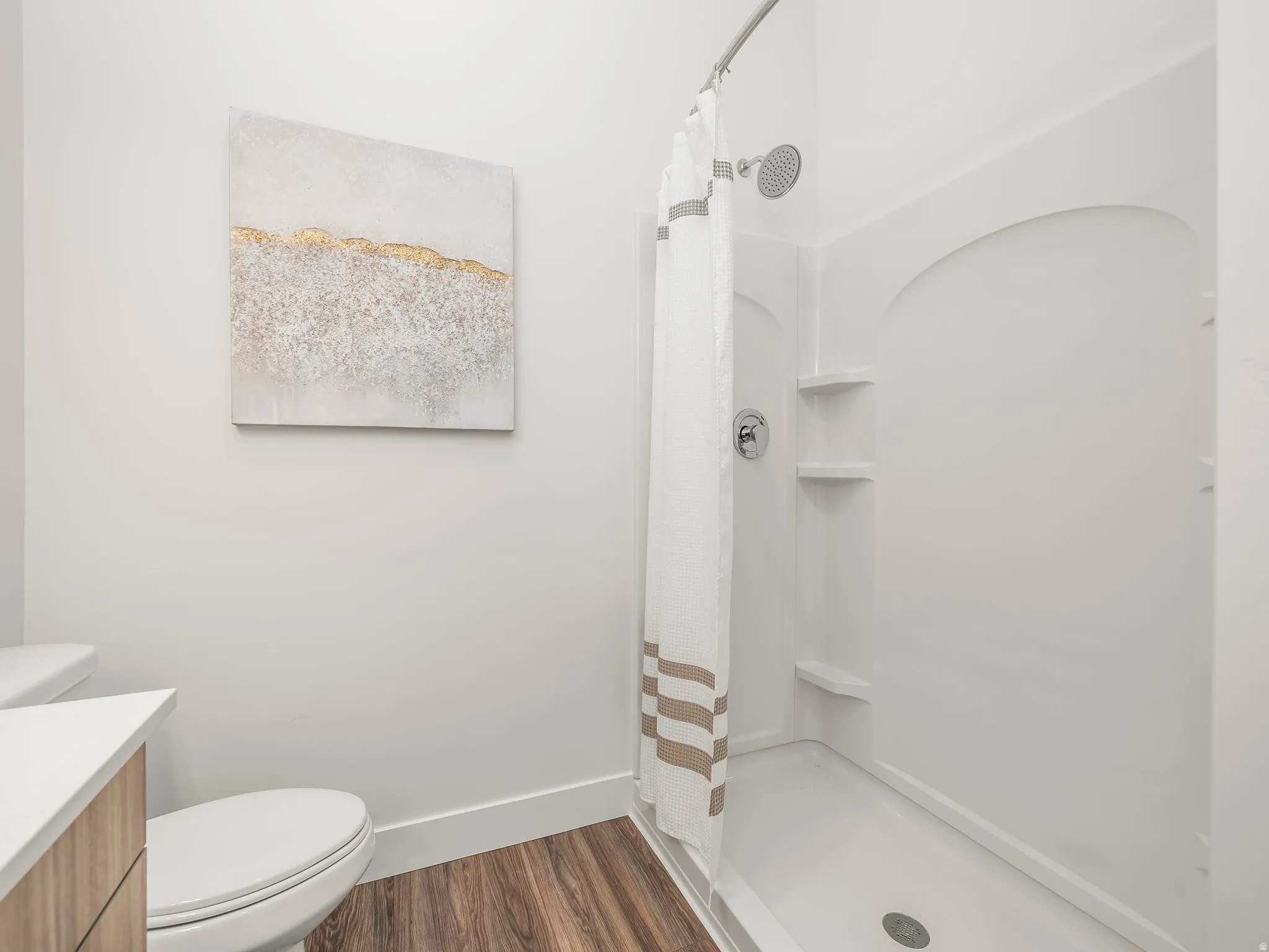 Private en suite bath with double sink and walk in shower.