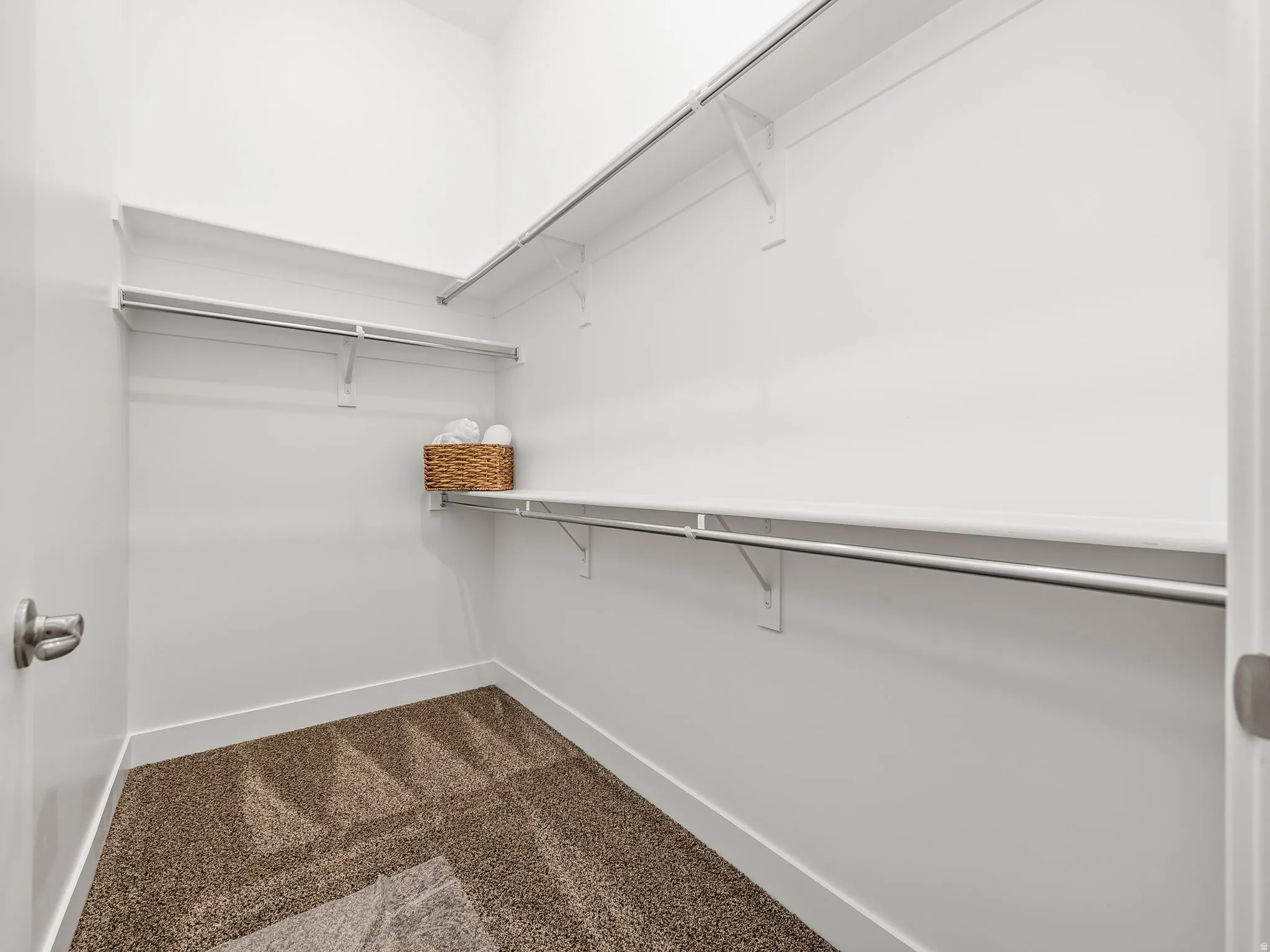 Primary bedroom walk in closet.
