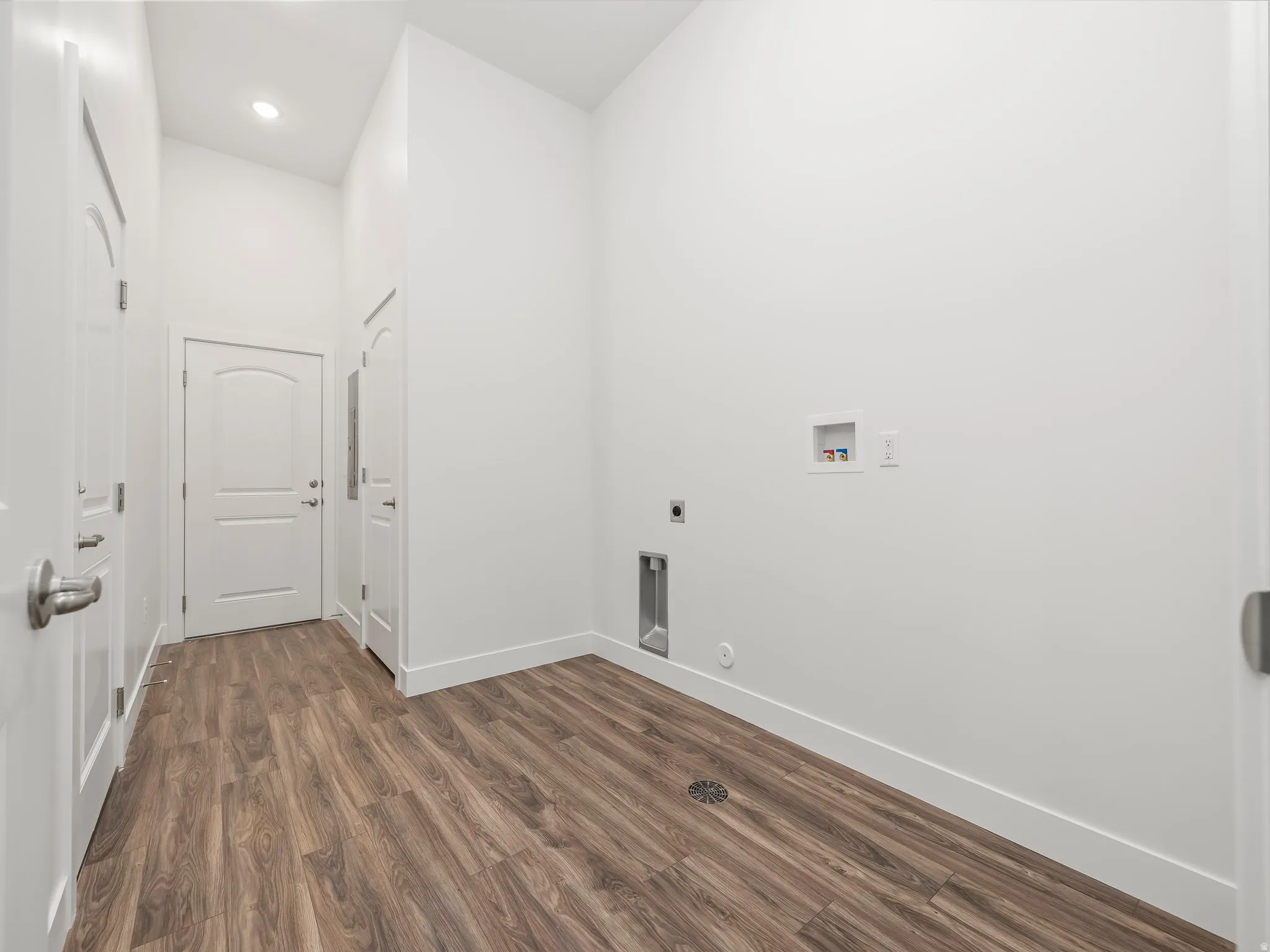 Laundry room with extra storage and access to the garage and common breezeway.