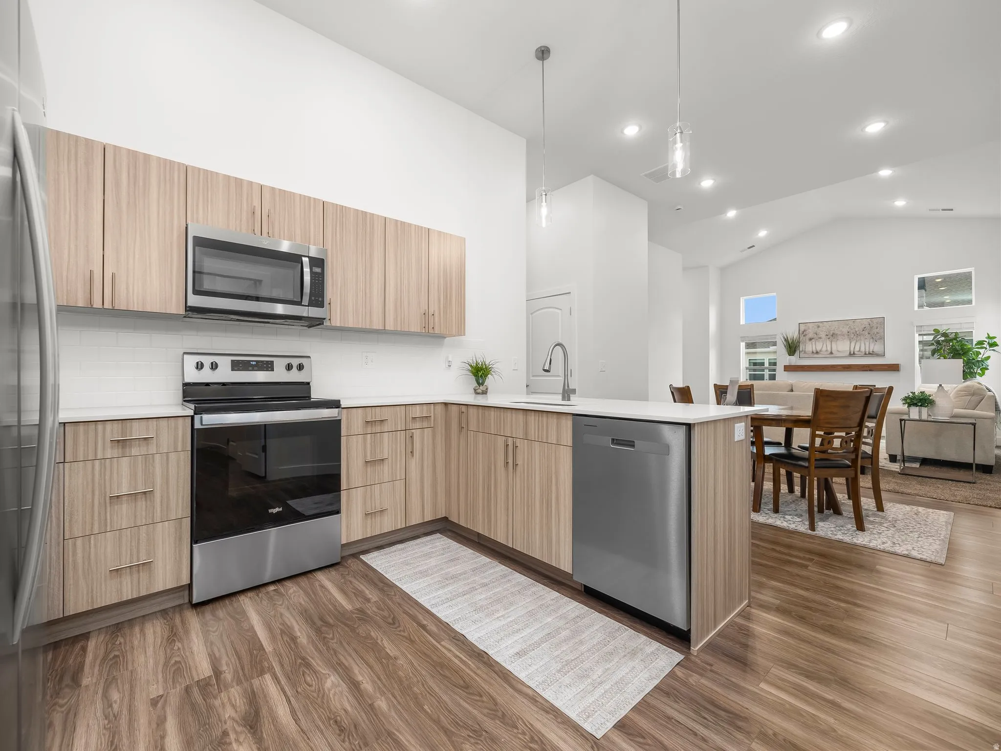 Kitchen with stainless steel appliances and quartz counters. *Fridge not included*