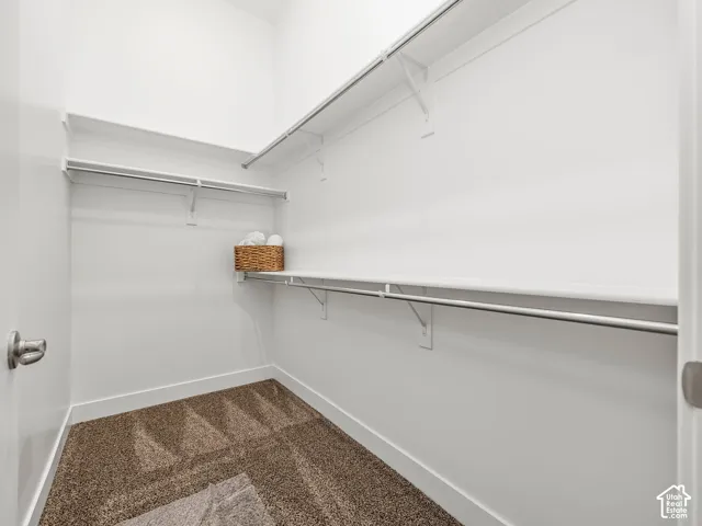 Primary bedroom walk in closet.