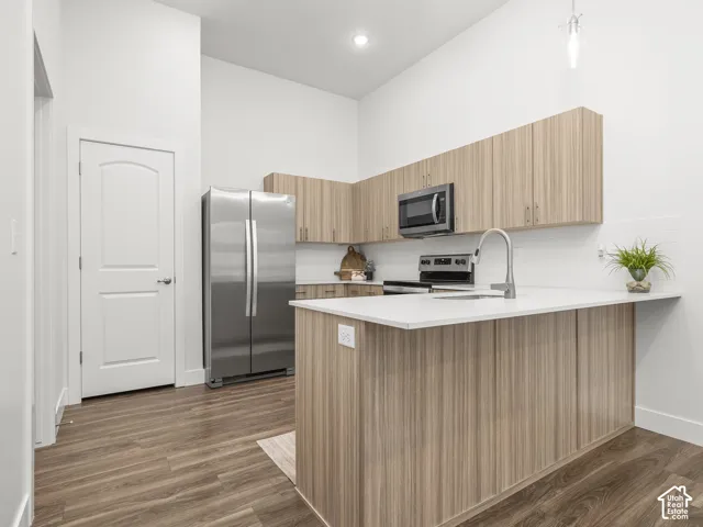 Kitchen with stainless steel appliances and quartz counters. *Fridge not included*