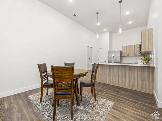 Dinging area opens to kitchen and living room for open concept living.