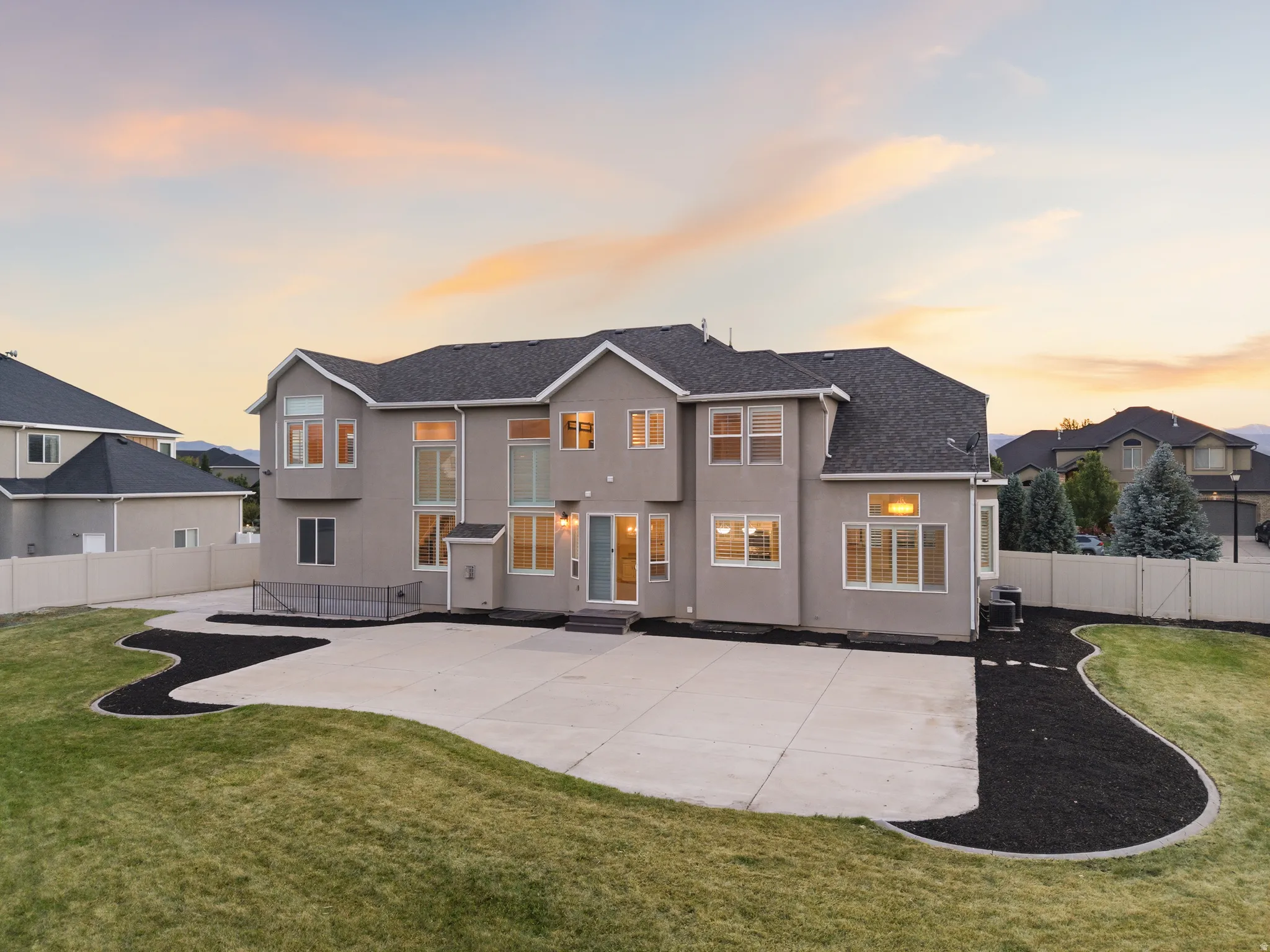 Expansive rear patio area with direct outdoor access