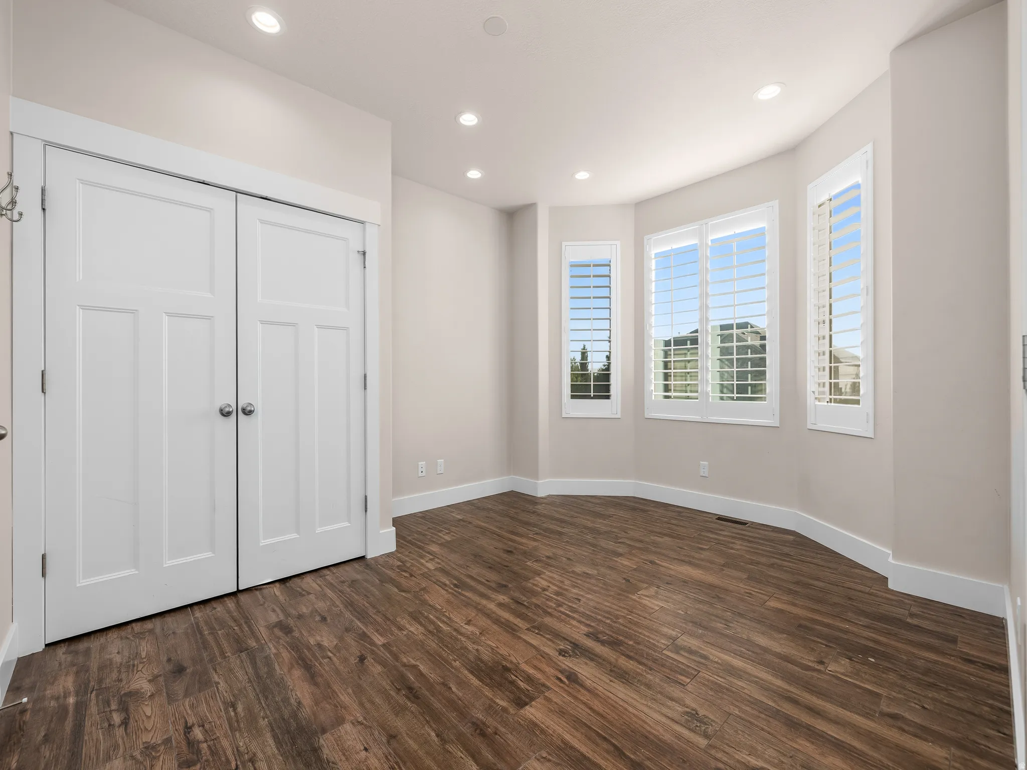 Wood-finish flooring with crisp white trim