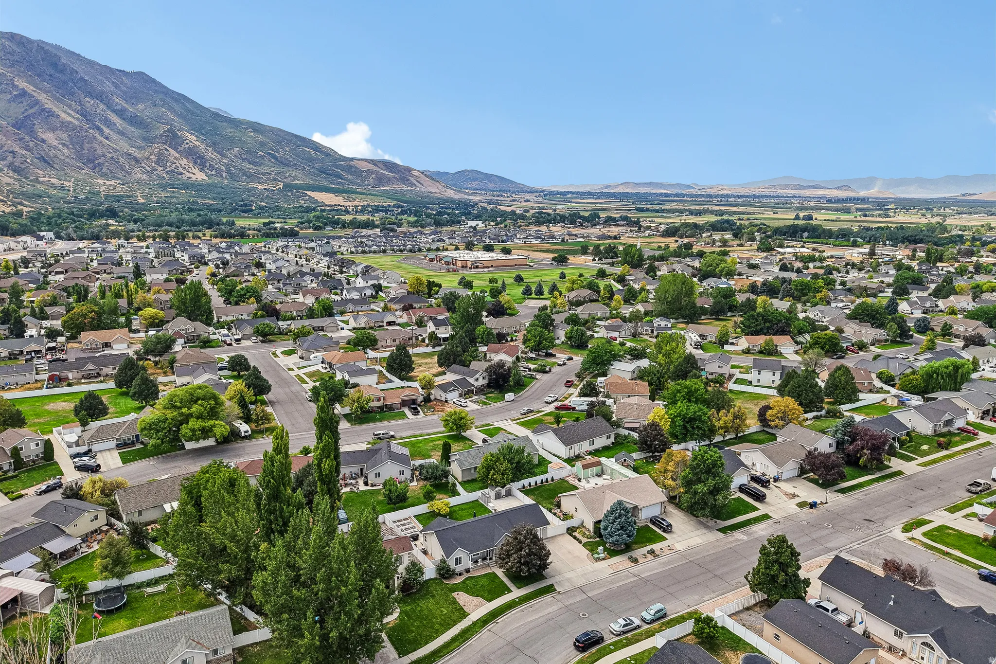 Expansive residential area featuring numerous single-story homes, mature landscaping, and paved streets
