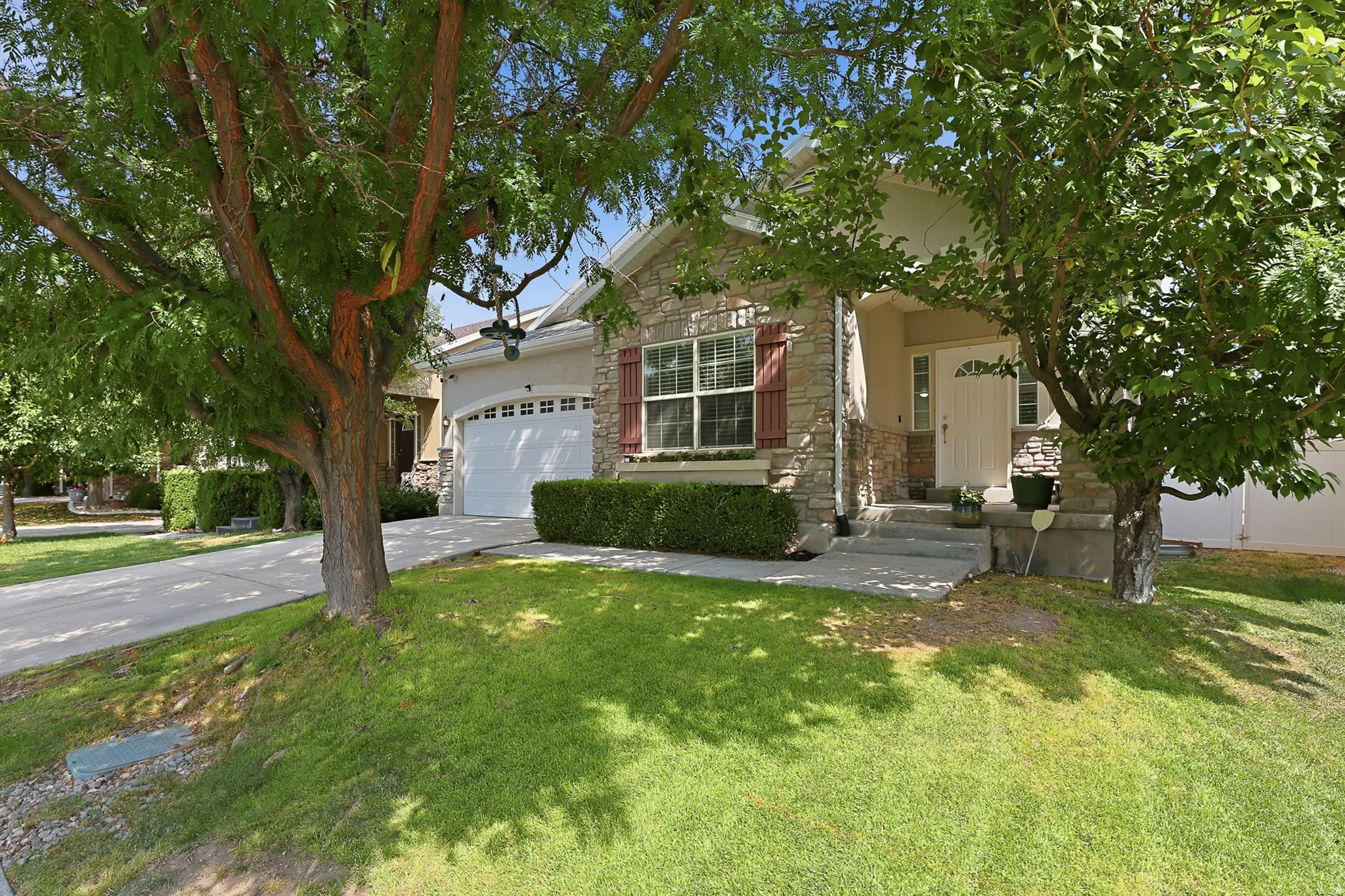 Charming home with mature shade trees framing the front lawn