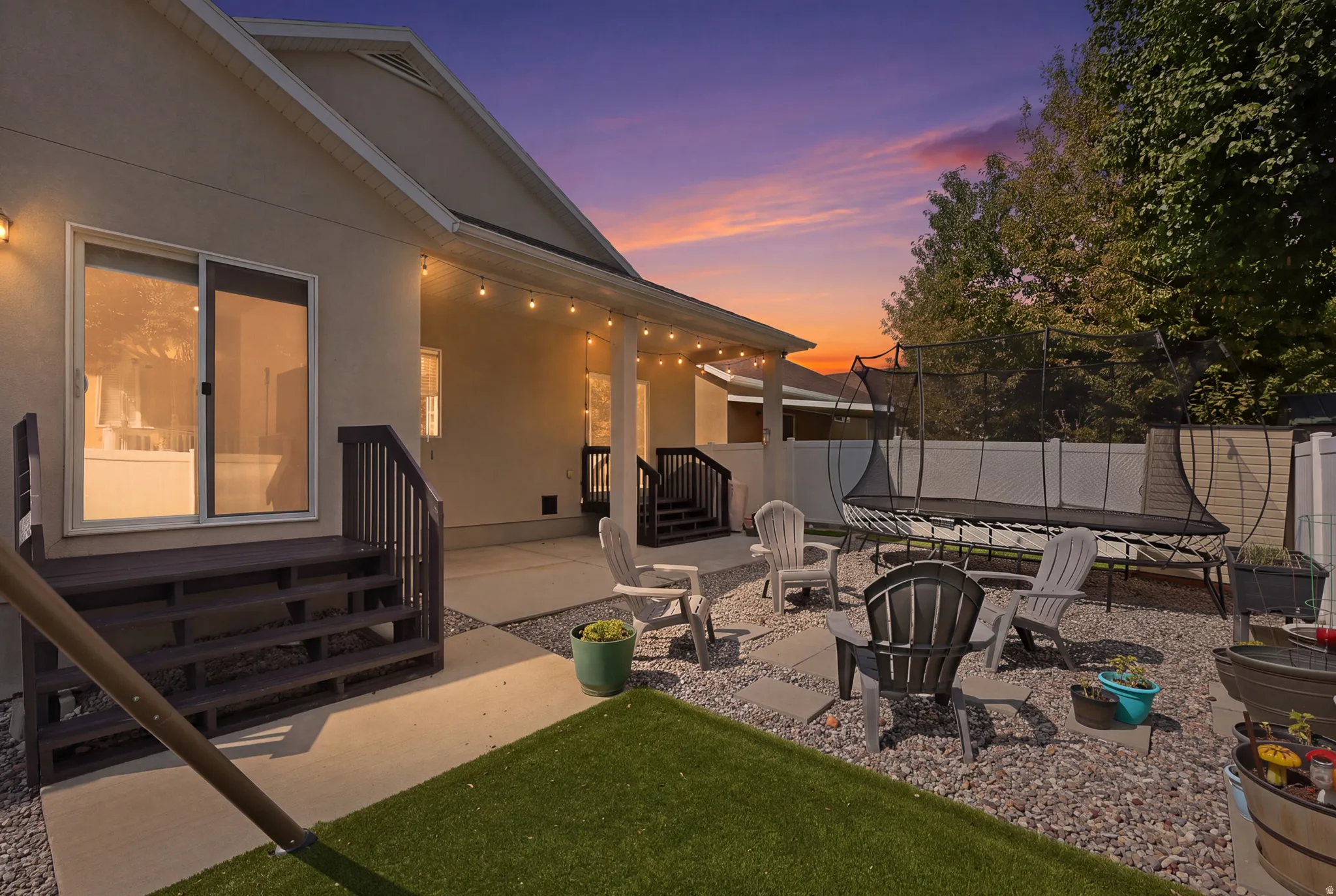 Covered patio with string lighting.