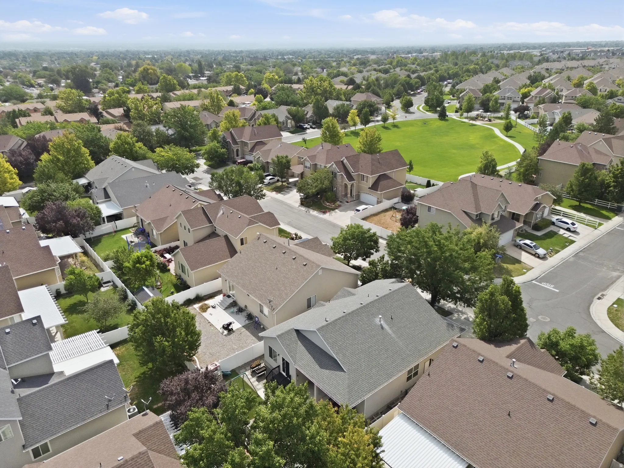 Residential neighborhood with mature trees and a central green space