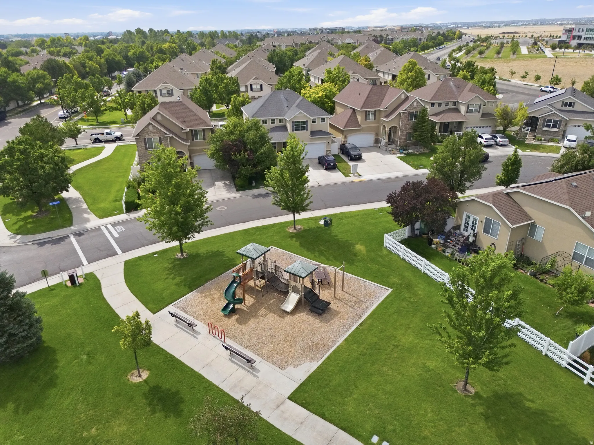Playground, paved walking paths, and mature trees