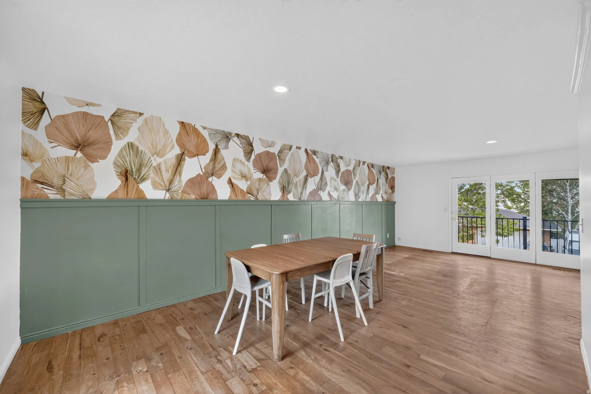 Dining area with access to balcony.