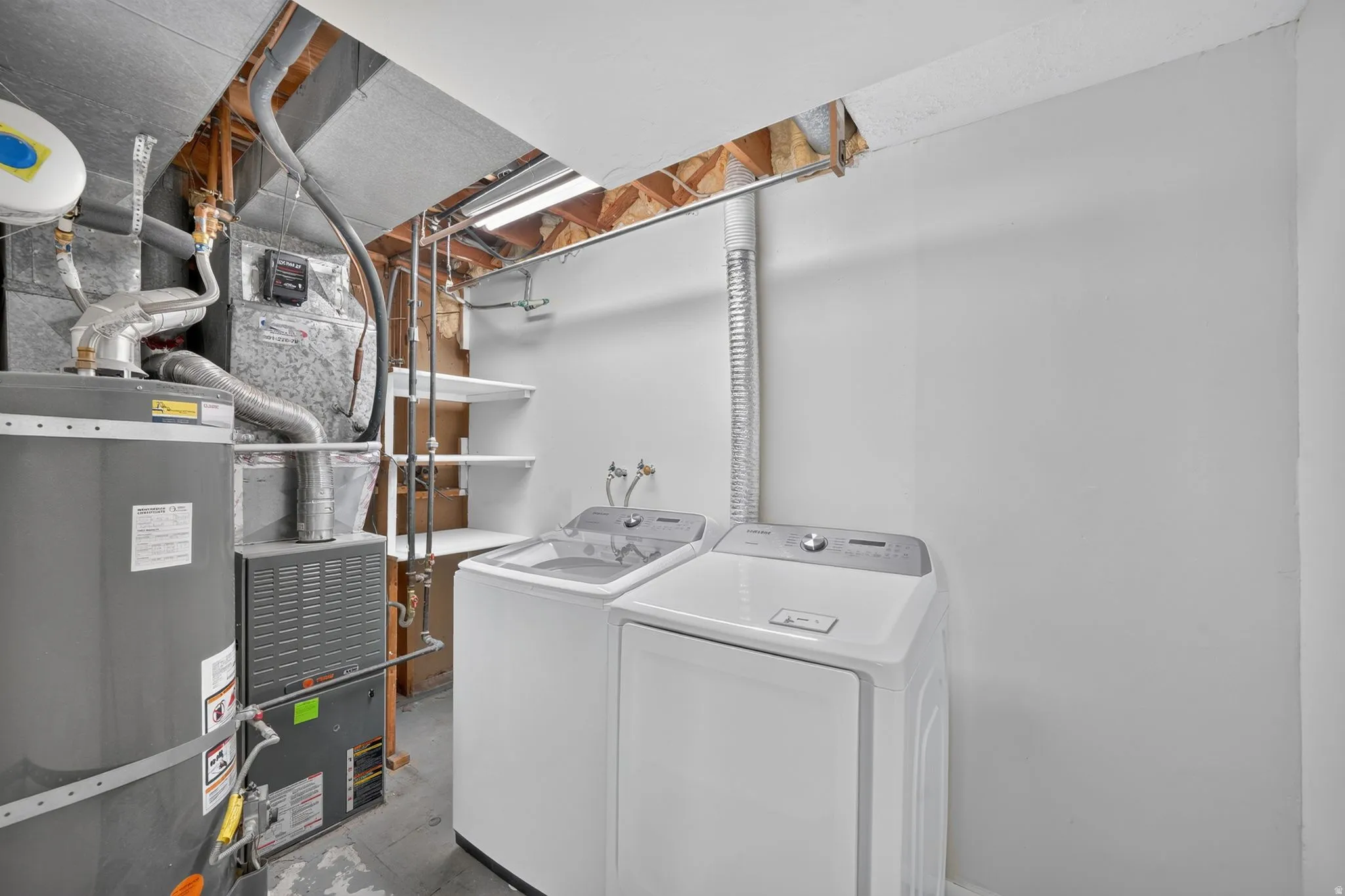 Laundry and utility area. Washer and Dryer included.
