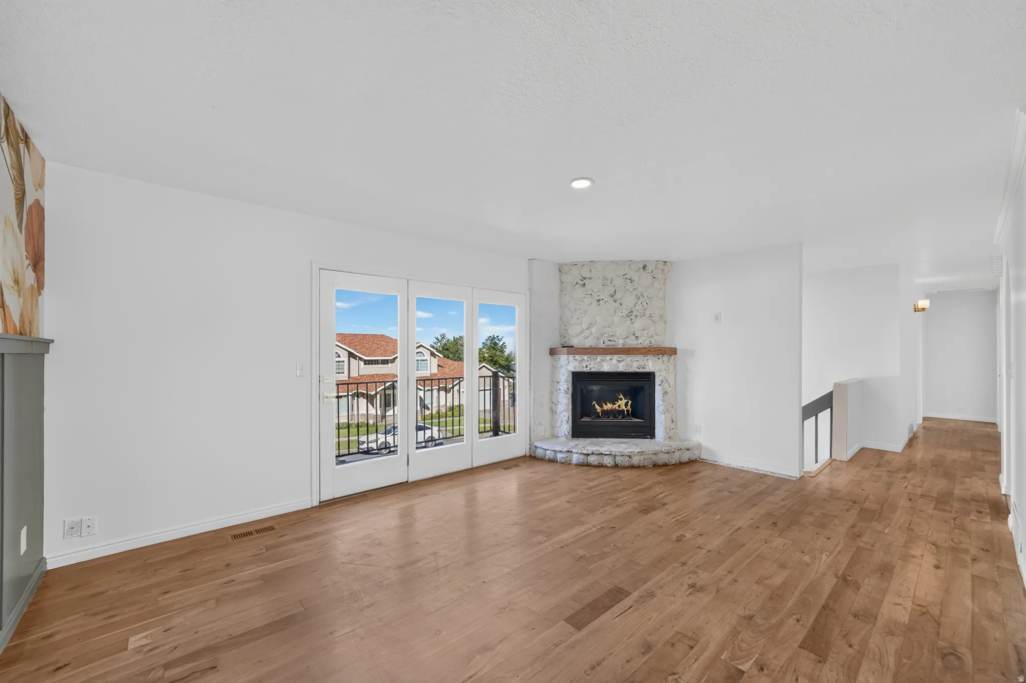 Upstairs living area featuring gas fireplace.