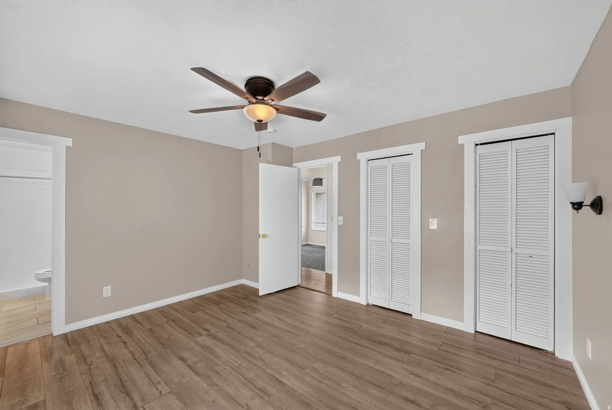 Upstairs primary bedroom featuring 2 closets.