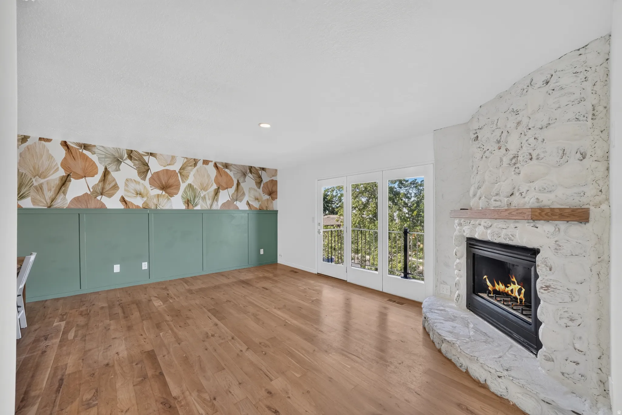 Upstairs living area featuring gas fireplace.