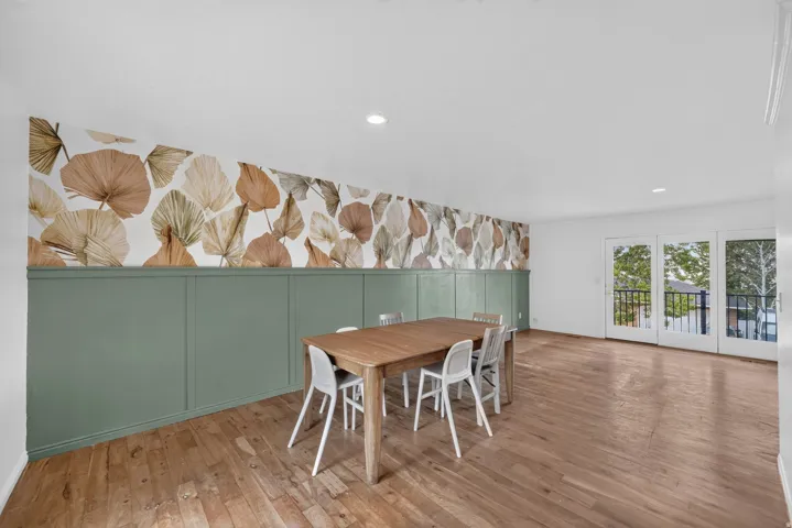 Dining area with access to balcony.
