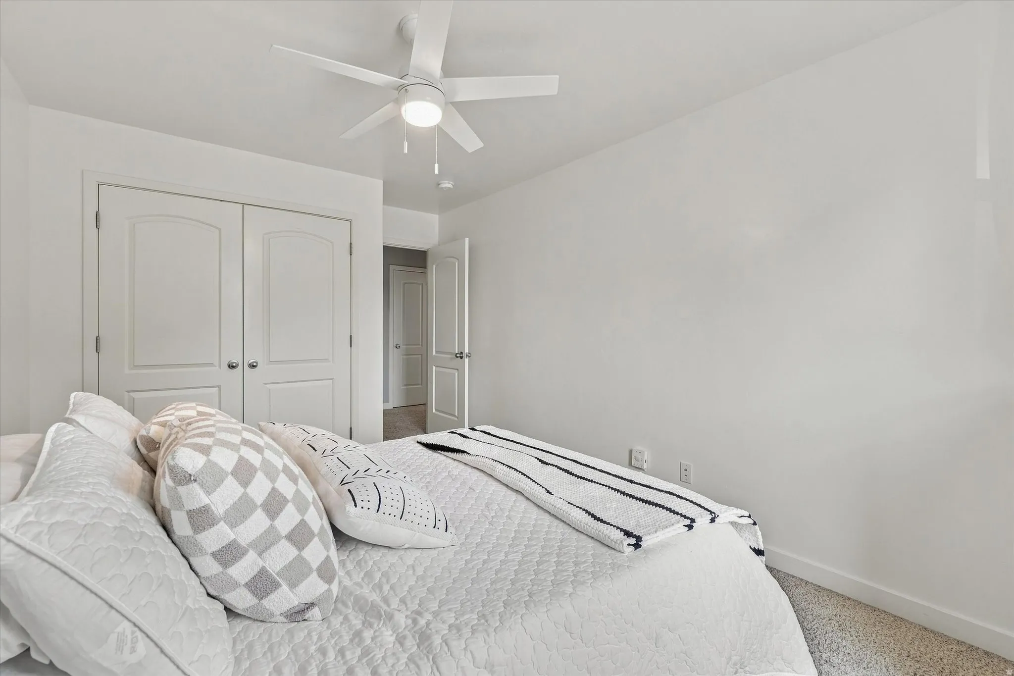Recessed lighting, ceiling fan with integrated light, carpeted flooring, and white paneled doors
