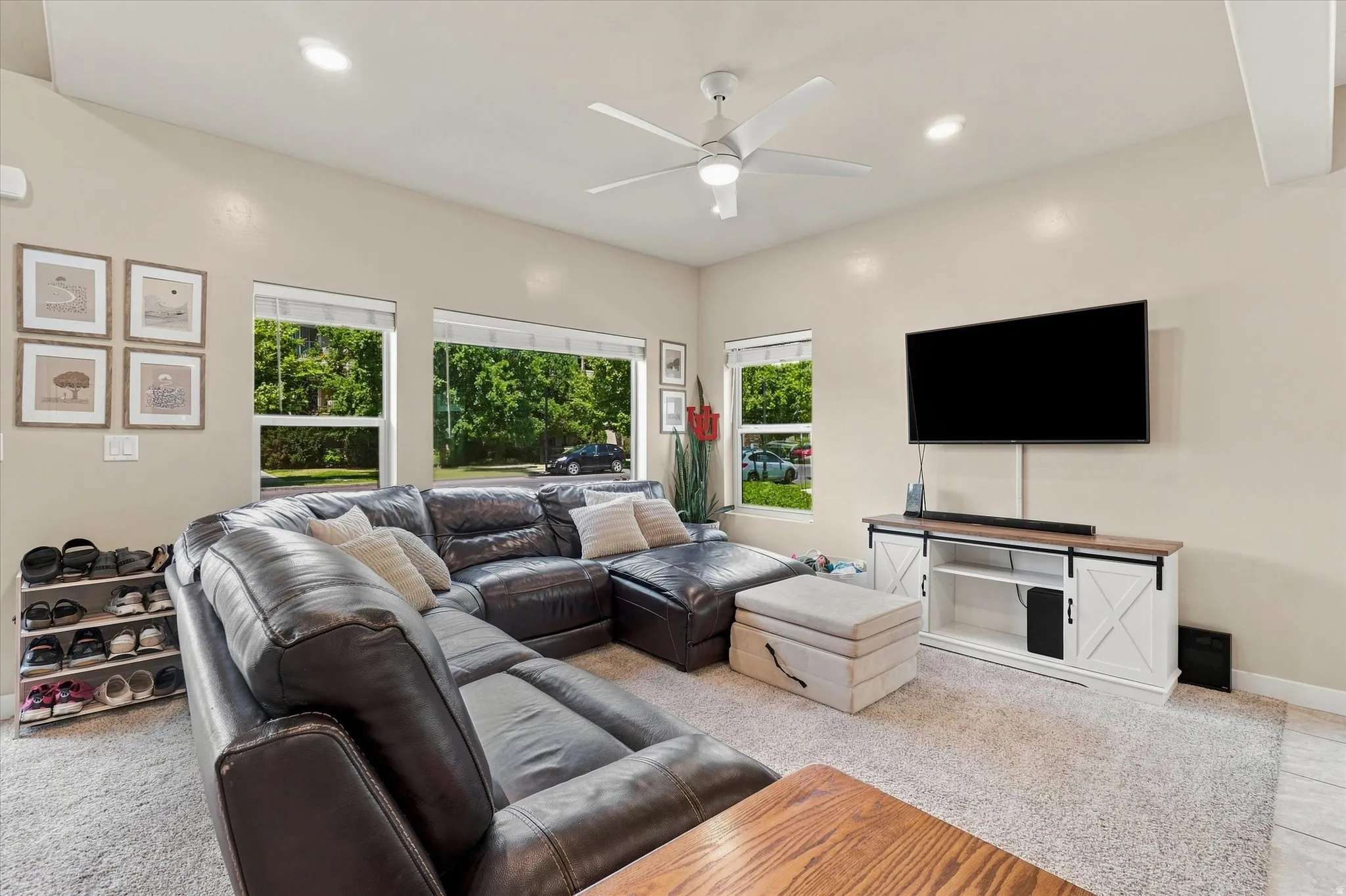 Recessed lighting, ceiling fan, multiple windows, and light neutral wall colors