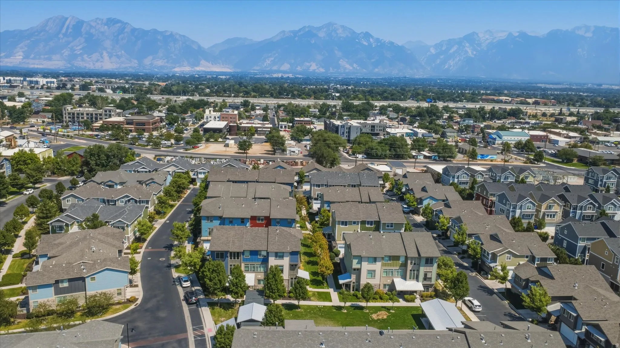 Aerial perspective showcasing a residential community with varied architectural styles and mature landscaping
