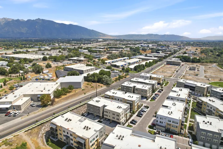 New construction residential development featuring multi-story buildings and integrated parking