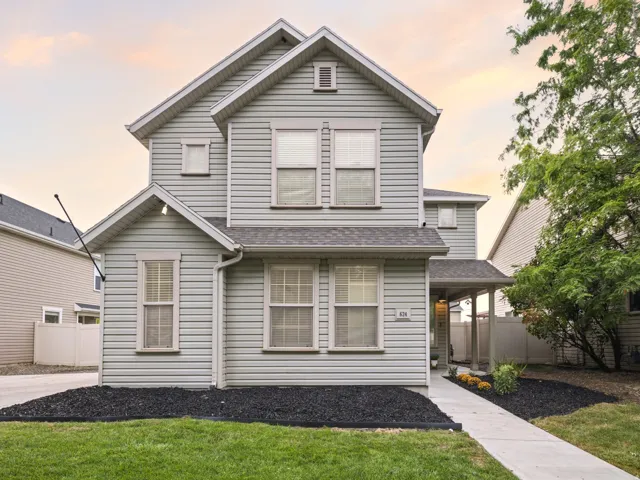 Two-story exterior with light-colored siding