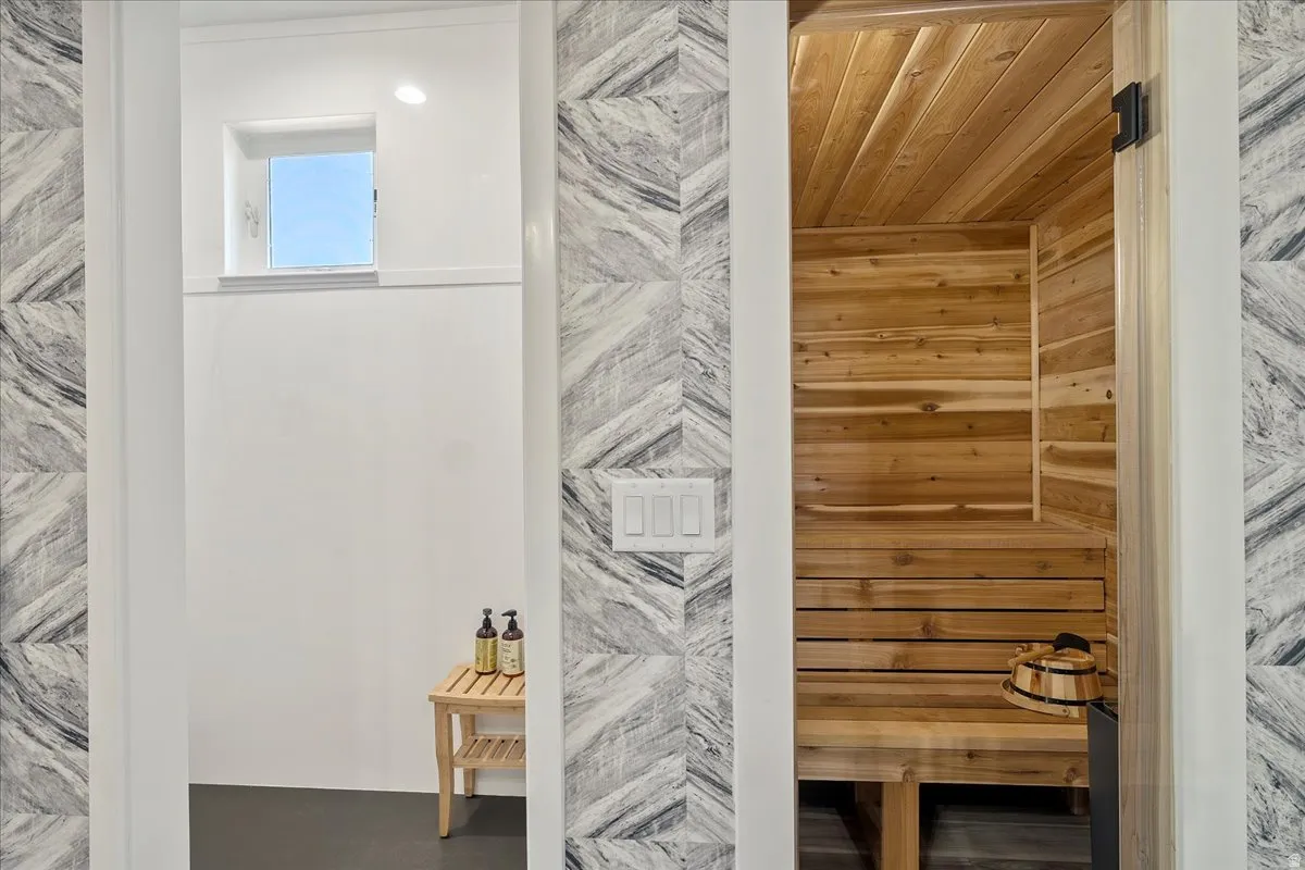 Integrated sauna with wood paneling and bench seating