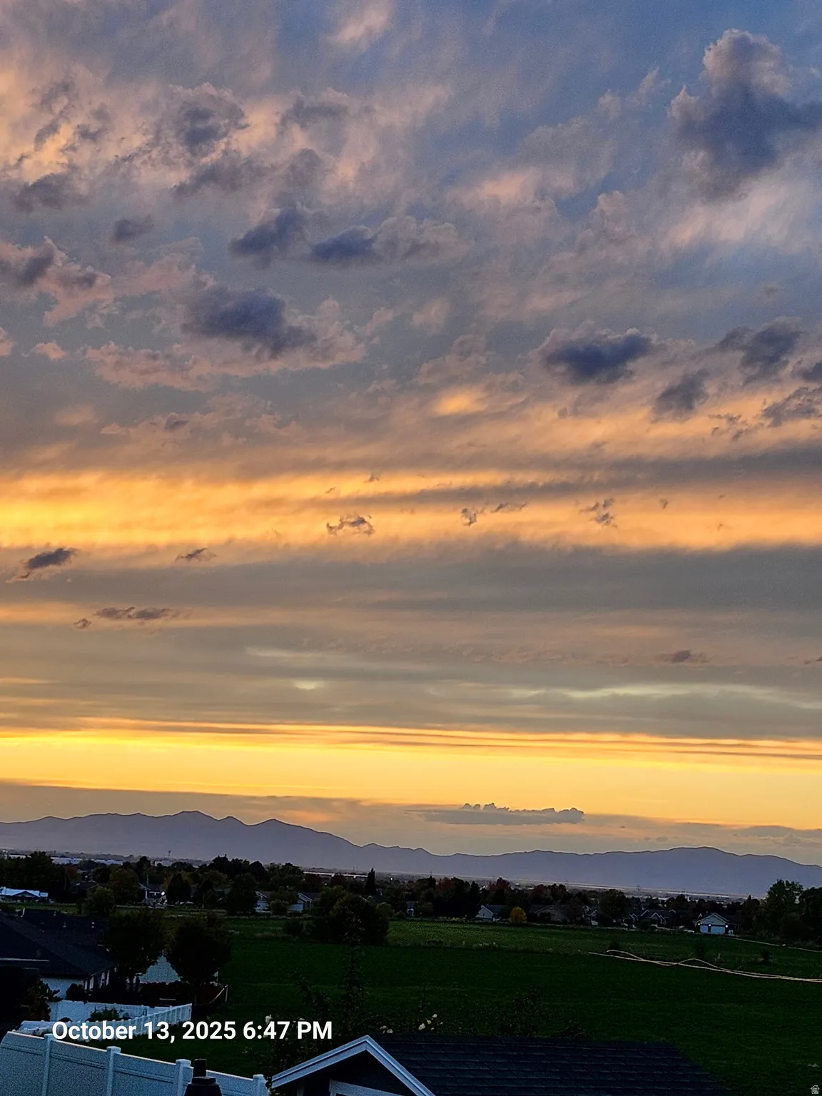 View from the deck of an Expansive mountain backdrop with a wide-ranging sky