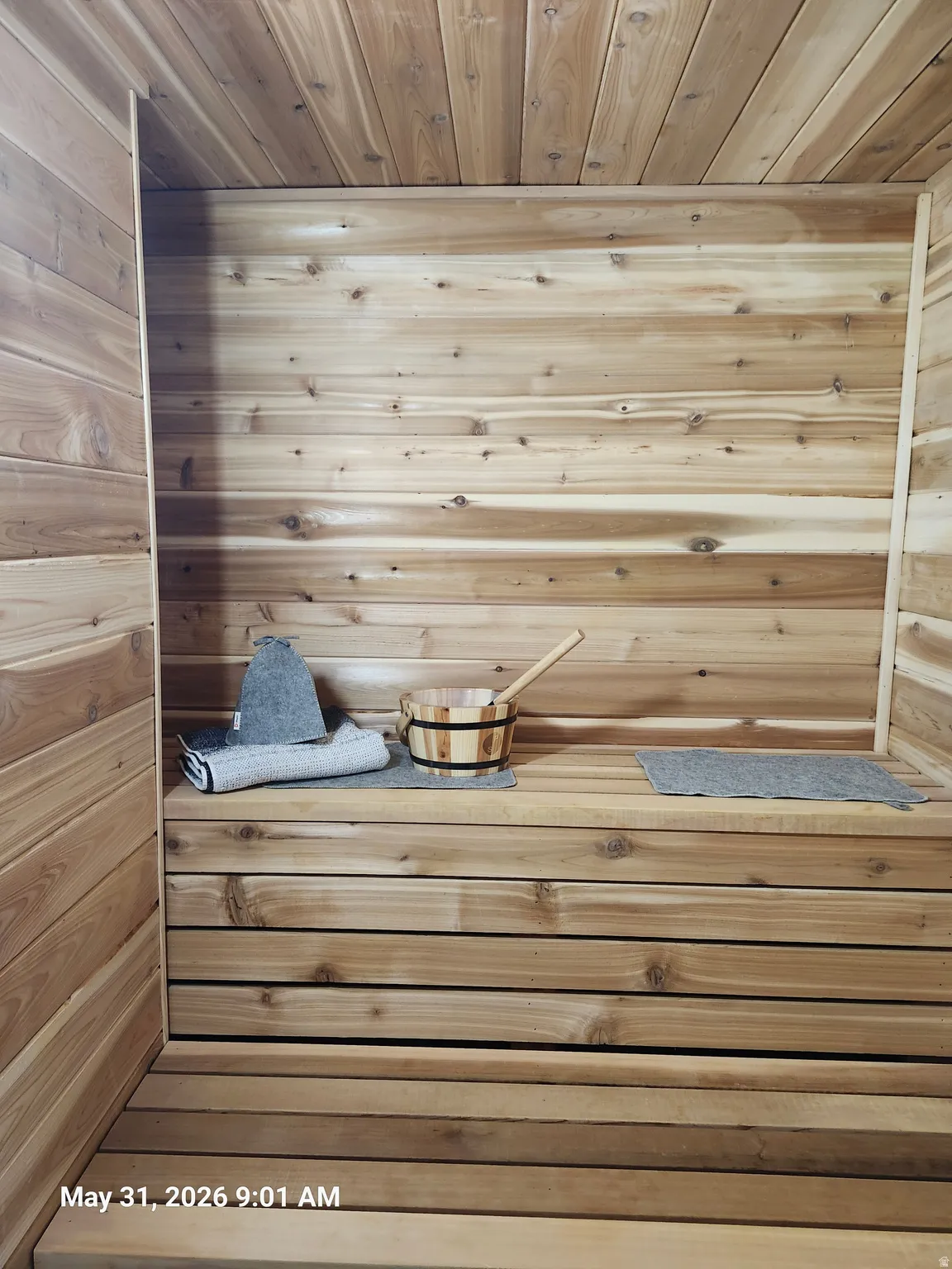 Wood-paneled interior featuring slatted bench seating