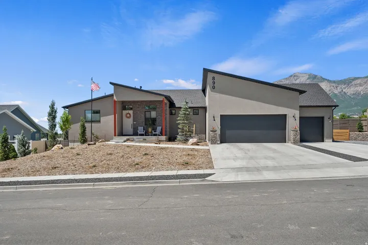 Modern exterior with a distinctive angled roofline and stucco finish