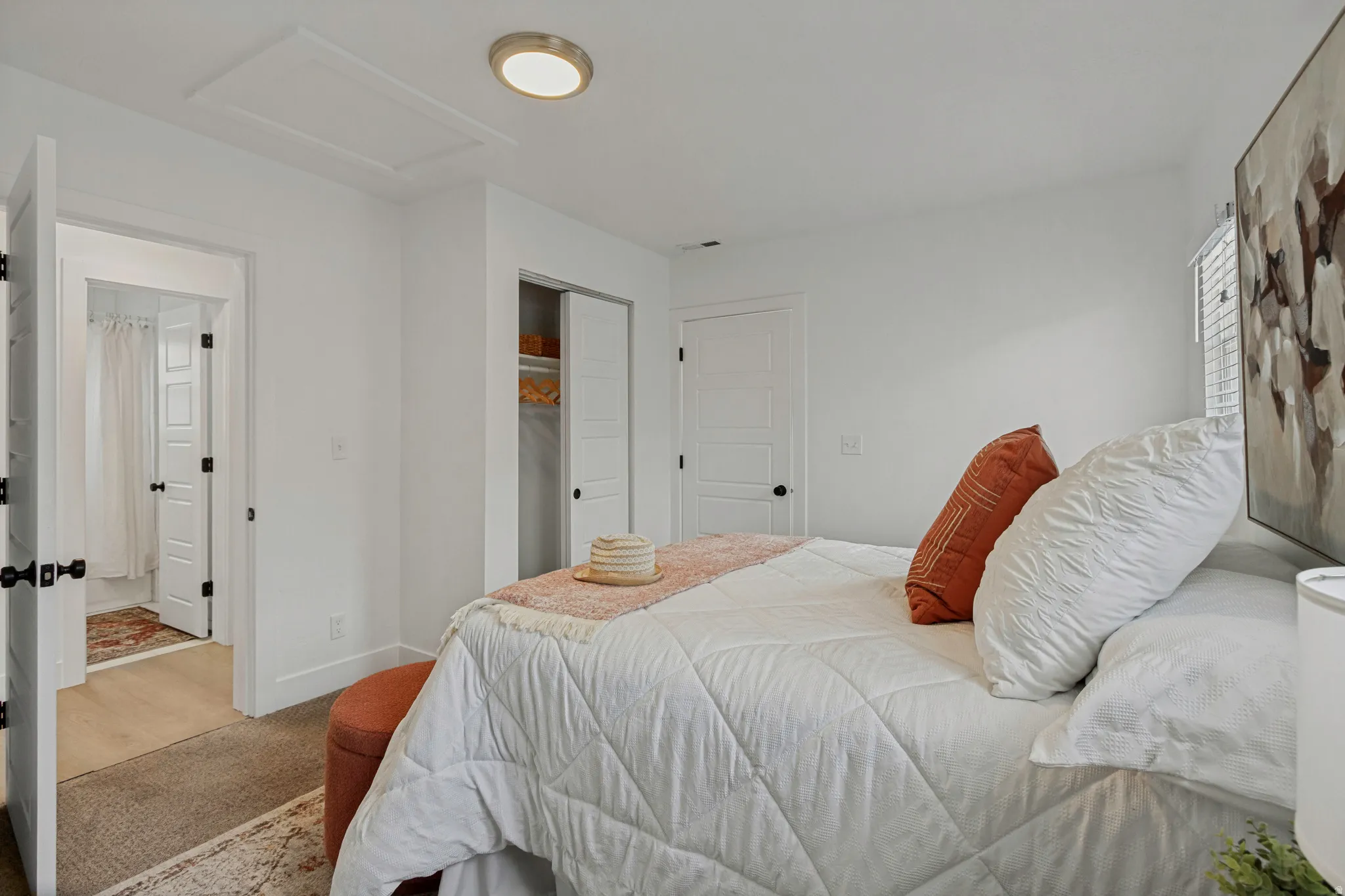 White walls complement the wood-finish flooring