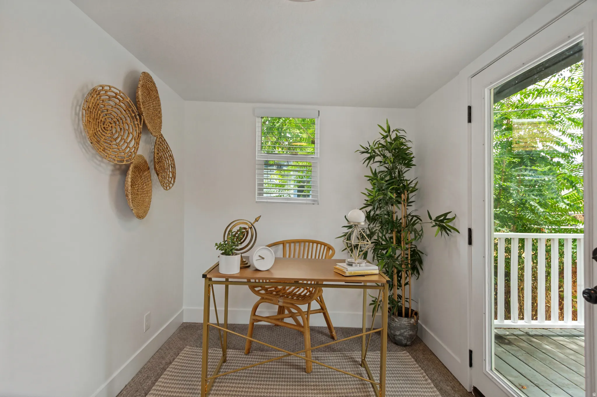 Crisp white walls, neutral carpet, and a large window with blinds