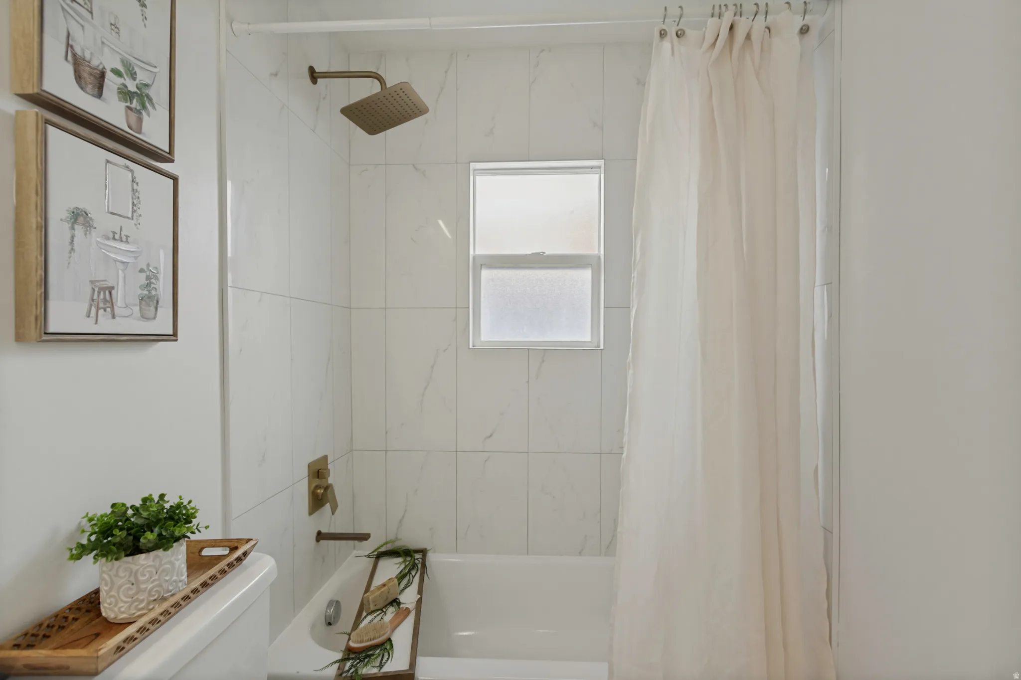 Bathtub with subway tile surround, rain shower head, and wall-mounted fixtures