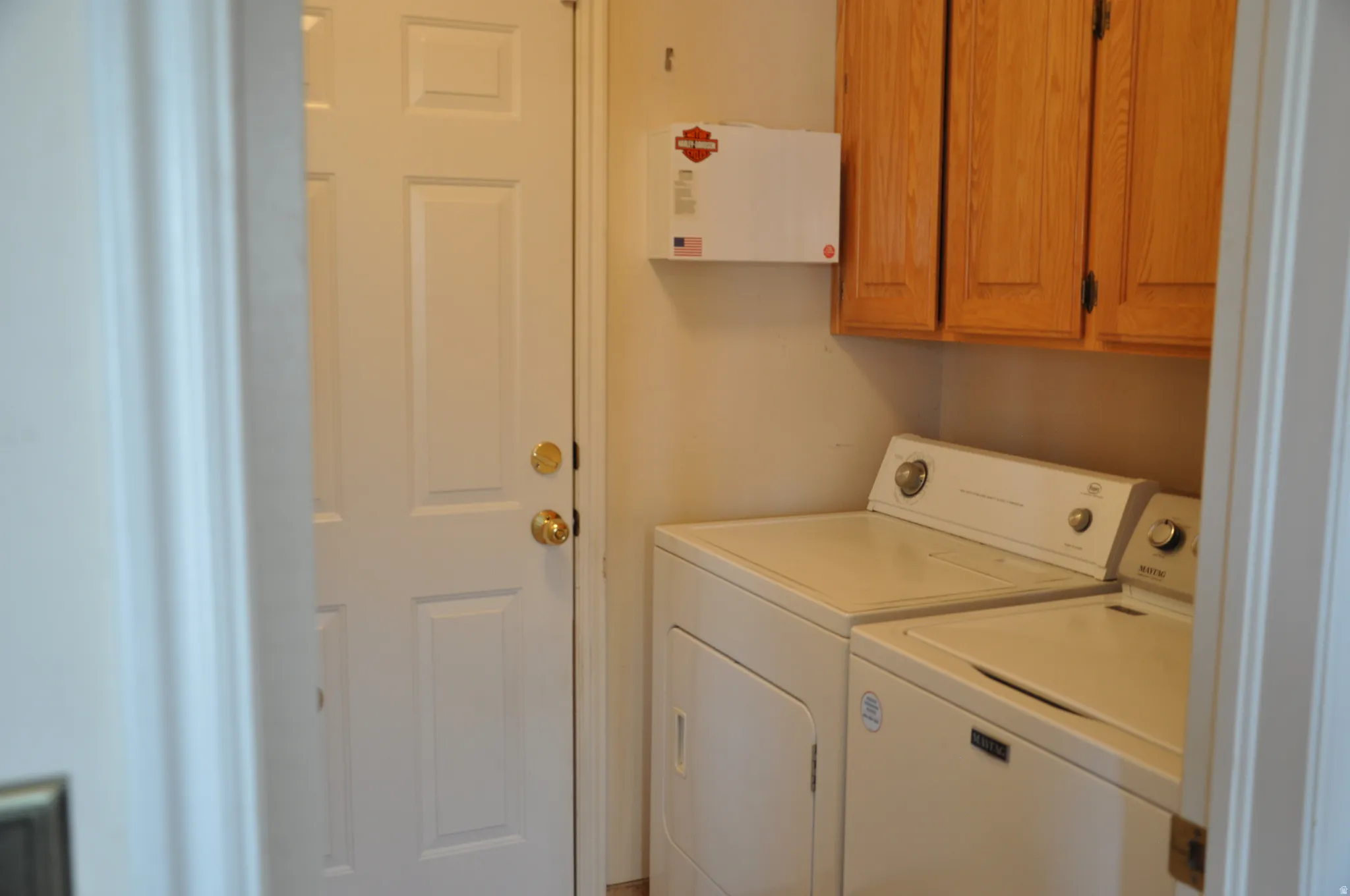 Built-in wood-finish cabinetry providing storage