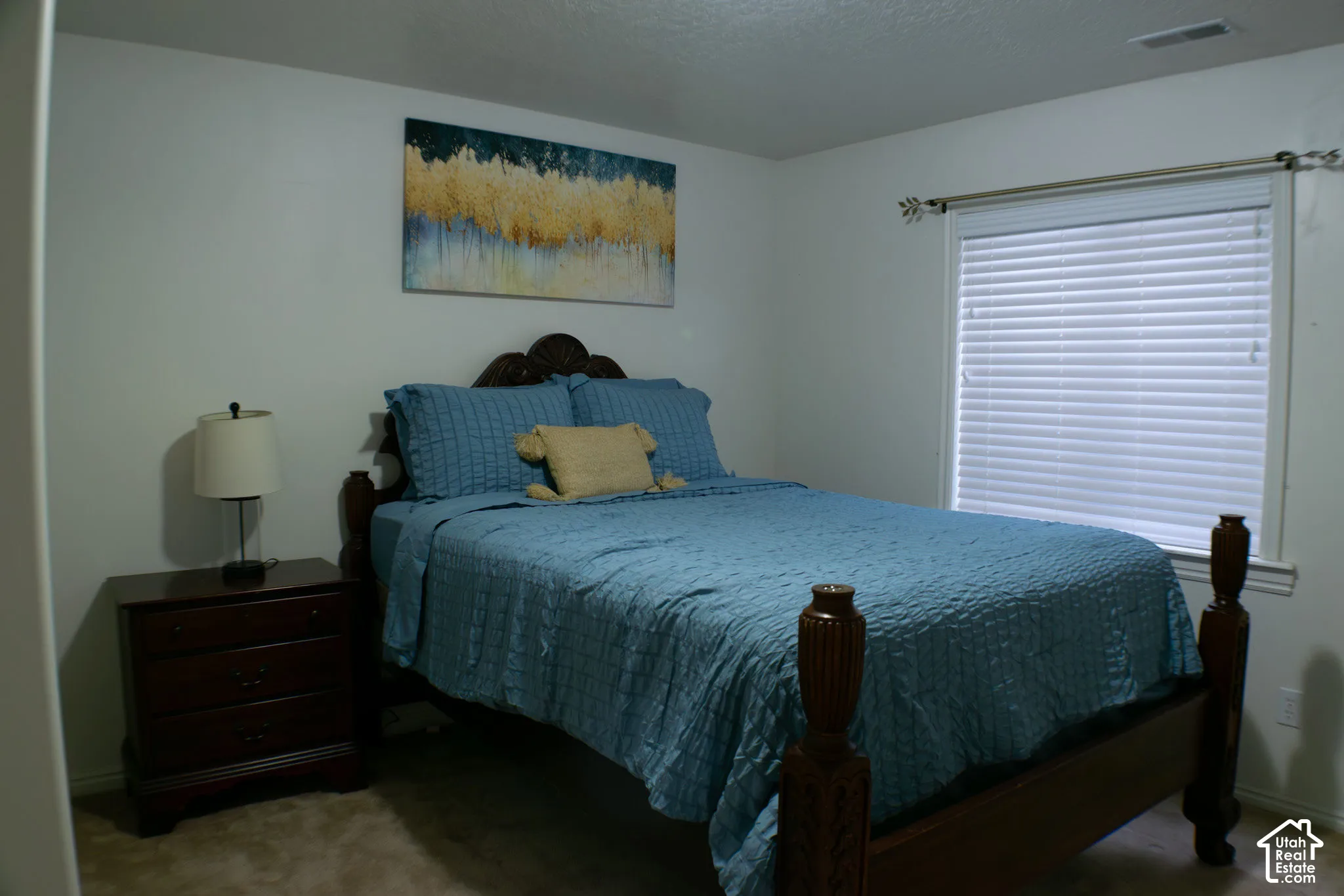Third bedroom has enough space for a king or queen bed, dresser and vanity.  Currently shown with a queen bed and nightstand.