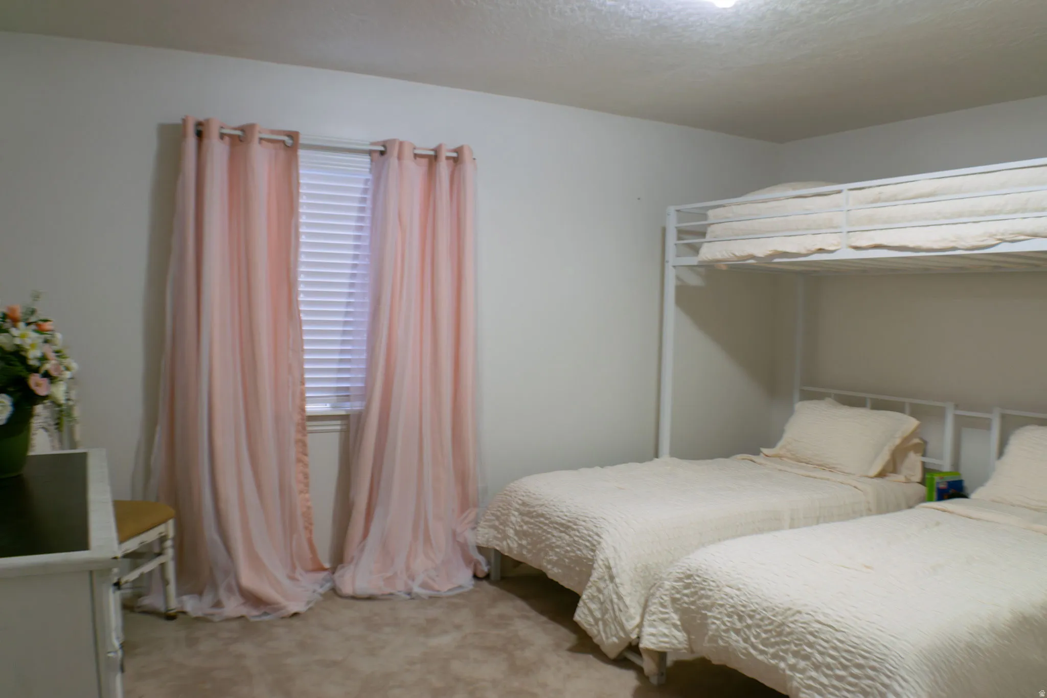 Recessed lighting and a window with blinds