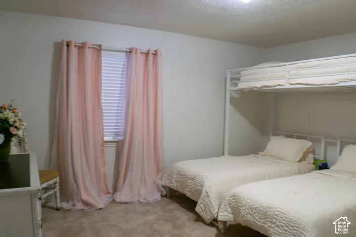 Second bedroom is large enough for triple bunks, dresser, toy storage and has a large closet