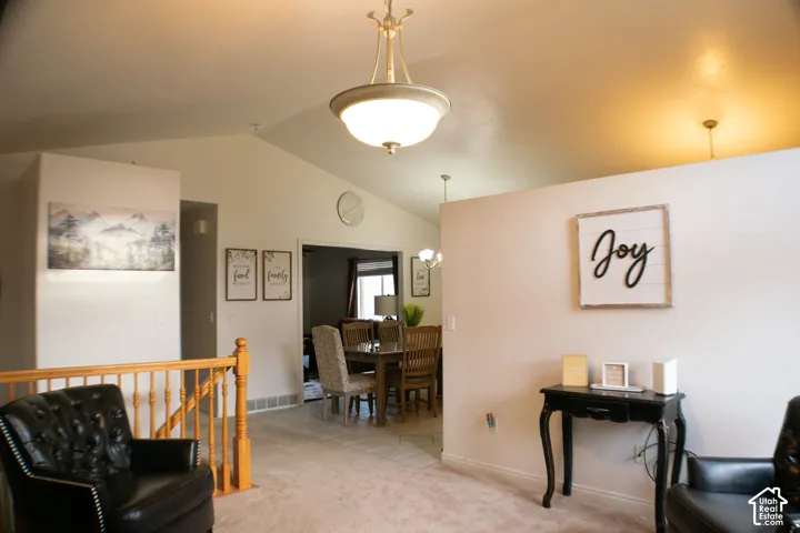 Entrance begins with this open, inviting visiting room that is large enough to be a home office, or host extra tables and chairs for larger gatherings.