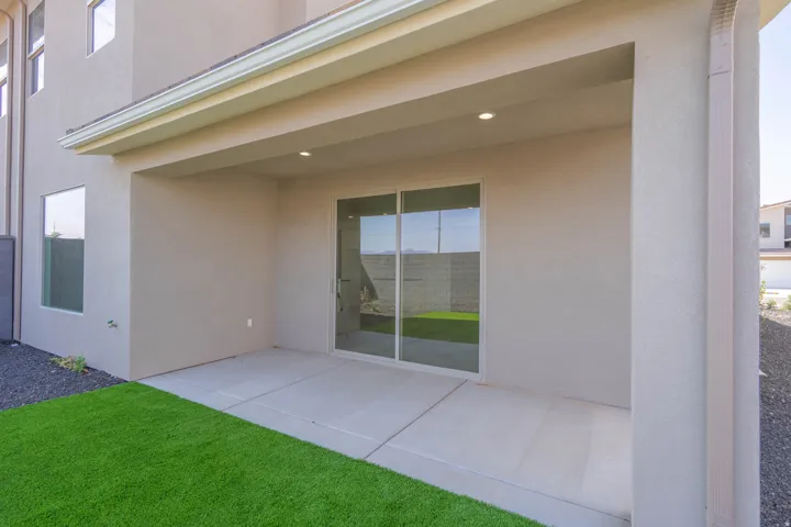 Covered patio with recessed lighting, concrete flooring, and sliding glass door