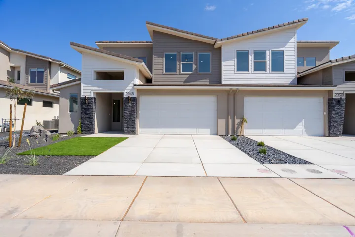 Modern multi-story exterior with an asymmetrical roofline