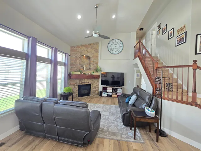 Vaulted ceilings with recessed lighting and ceiling fan