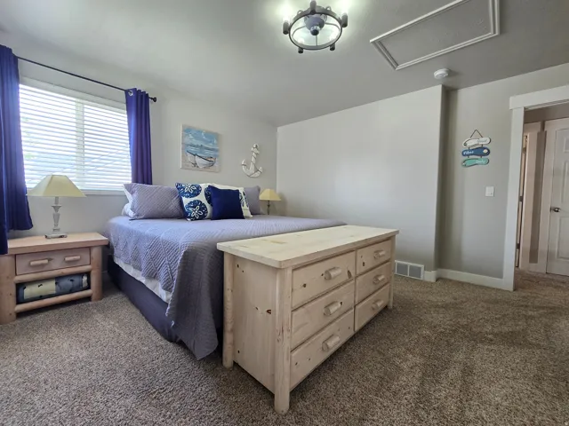 Wall-to-wall carpeting and a ceiling-mounted light fixture