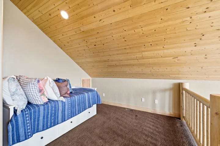 Wood-paneled ceiling with recessed lighting