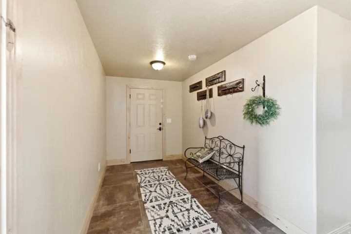 Recessed entryway with durable floor tiles and light-toned walls
