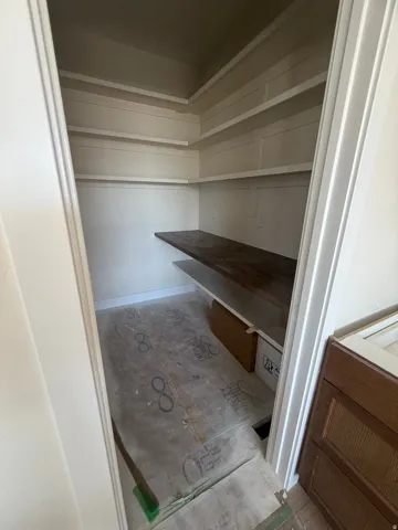 Built-in shelving with a dark wood-finish countertop