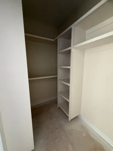 Built-in shelving units, adjustable hanging rods, and painted walls