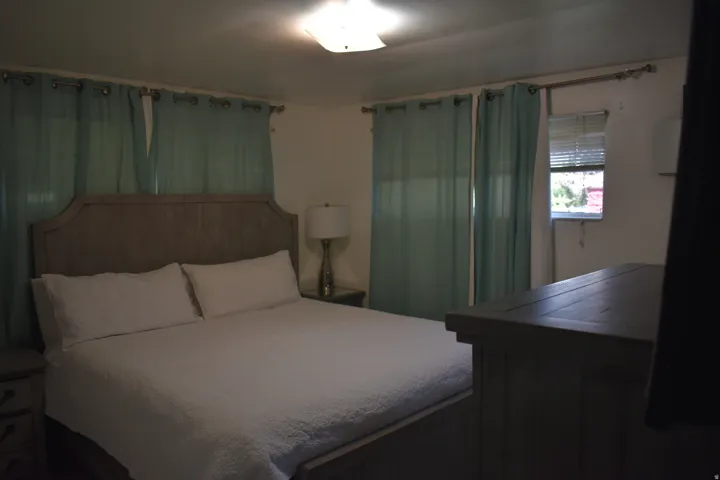 Ceiling-mounted light fixture illuminates the room