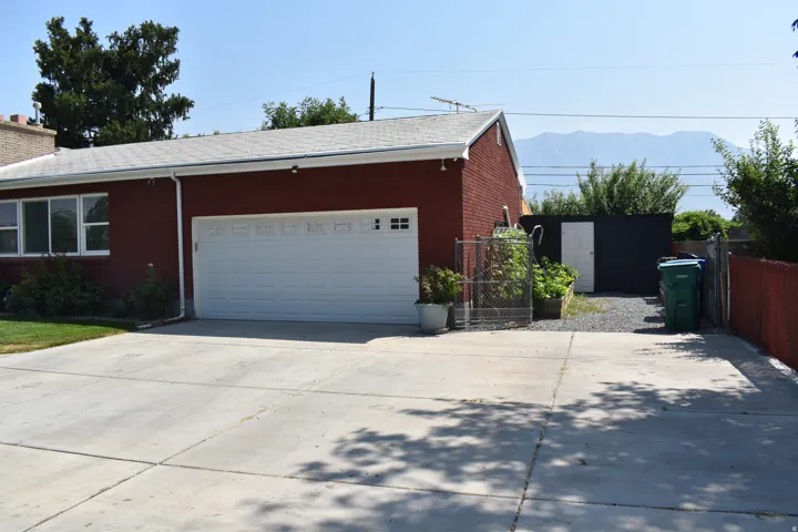 Attached garage with white door