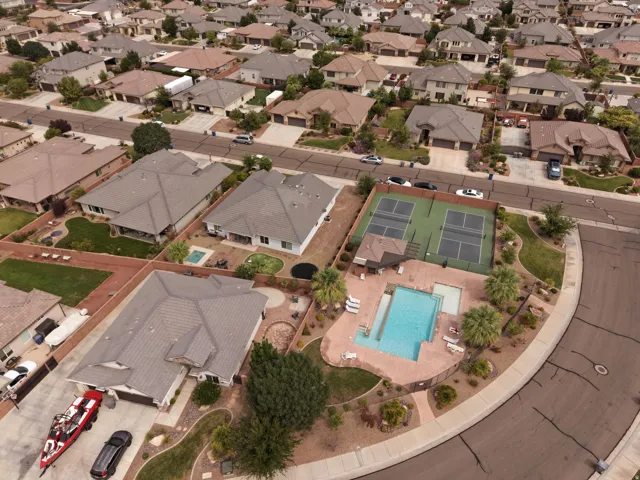 Community features including a swimming pool, tennis courts, and residential properties
