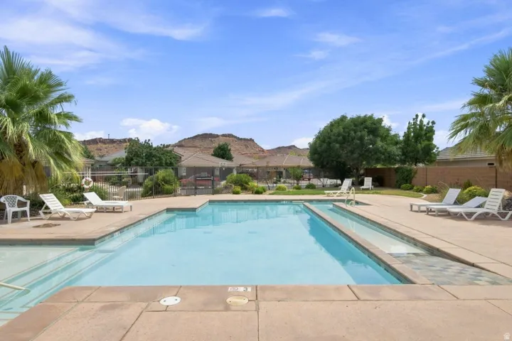 Outdoor swimming pool with integrated steps, surrounded by a concrete deck
