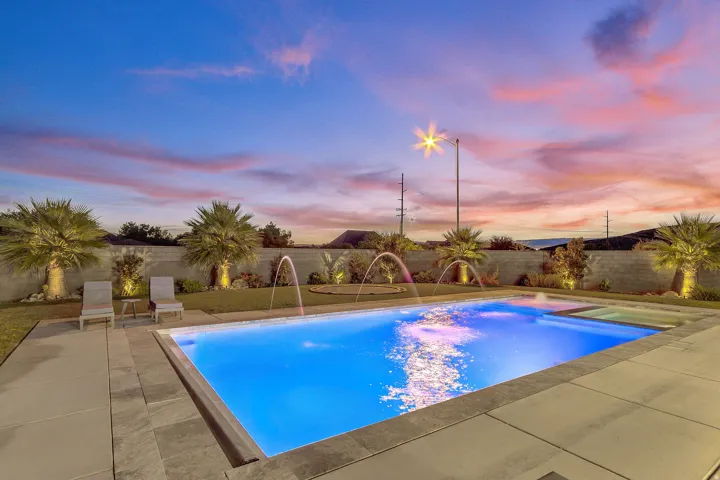 Resort-style pool with integrated spa and water features